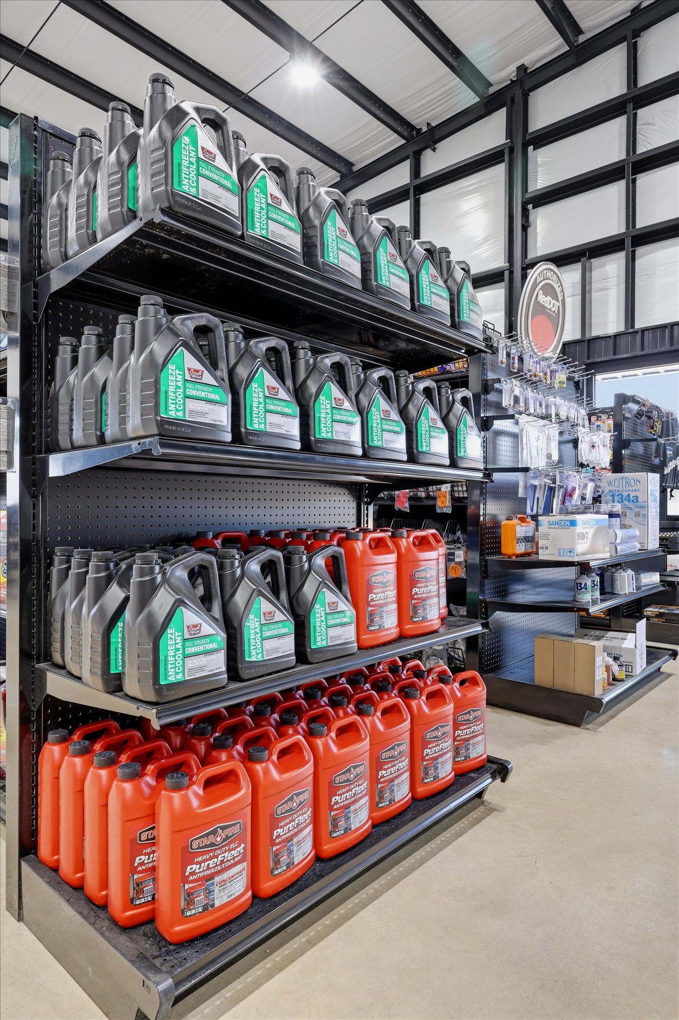 Wilkerson parts shelf stocked with diesel oil and fluids